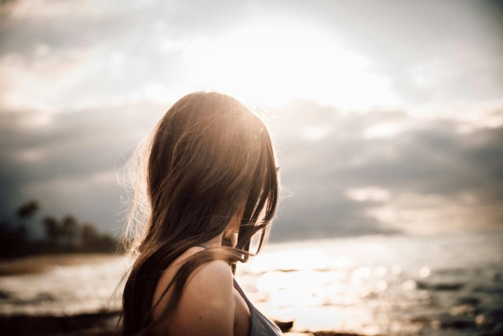 woman looking into distance pensive